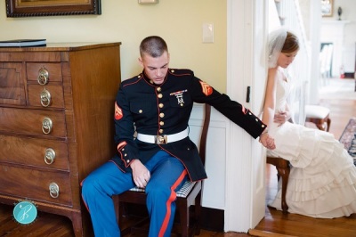 Bre and Joshua Curtas of Lynchburg, Va. pray together at their August 2012 wedding ceremony.