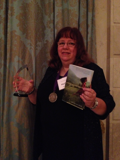 Christian fiction author, Marilyn Sue Shank after winning the Christy award in the Young Adult category for Child of the Mountains at the Christy Awards gala held at the Renaissance Grand in St. Louis, Mo., on Monday June 24, 2013.