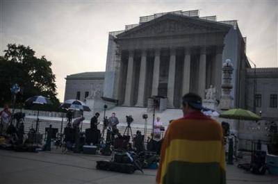 Journalists stake out positions early in the morning to report on decisions expected in two cases regarding same-sex marriage at the U.S. Supreme Court in Washington, June 26, 2013