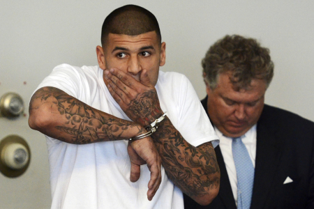 New England Patriots tight end Aaron Hernandez is arraigned on charges of murder and weapons violations in Attleborough, Massachusetts, after being arrested, June 26, 2013. Hernandez, a 23-year-old rising football star with the New England Patriots, was arrested by police in a murder investigation and fired by the team.