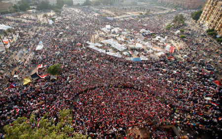 Protesters opposing Egyptian President Mohamed Mursi take part in a protest demanding that Mursi resign at Tahrir Square in Cairo July 2, 2013. Egypt's army reprised its role as hero in a new act of the country's political drama on Monday with a move celebrated by protesters as a decisive blow against an unpopular president just two and half years after the military unseated his predecessor.