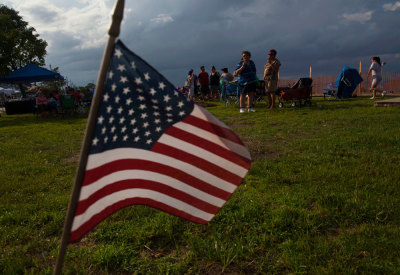 Women smoke at an Independence Day party in Union Beach, New Jersey July 3, 2013. The area was hit hard by Hurricane Sandy, but recovery continues along the coastline of New Jersey, including a party and fireworks for nearby residents one day ahead of the holiday.