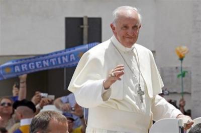 Pope Francis waves as he leaves after leading the weekly audience in Saint Peter's Square at the Vatican June 26, 2013.