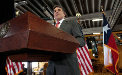 Texas Gov. Rick Perry announces he's not running for re-election as governor in 2014 during a news conference at Holt Cat in San Antonio, Texas, July 8, 2013.