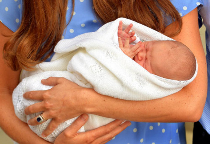 The Duke and Duchess of Cambridge, Prince William and Kate Middleton, leave the Lindo Wing of St Mary's Hospital in London, with their newborn son, George Alexander Louis, on Tuesday, July 23, 2013, in this photo provided to members of the media by The British Monarchy.