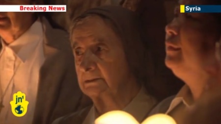 Christians praying for Syria in Jerusalem.