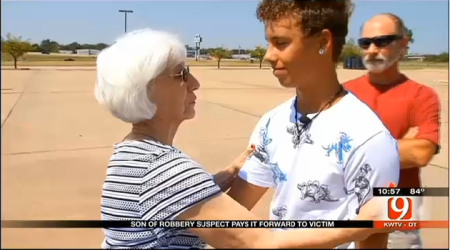 Tona Herndon (l) surprises Christian Lunsford, 15, (r).