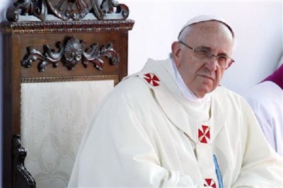 Pope Francis looks on as he leads a mass outside the Shrine of Our Lady of Bonaria in Cagliari September 22, 2013.