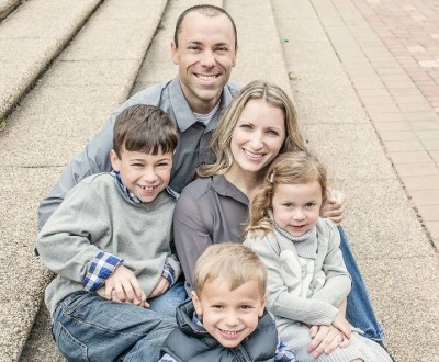 Michael Phillips, founder of All In, is shown here posing with his family.