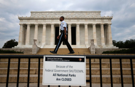 Credit : A National Parks policeman walks past a sign after the Lincoln Memorial was sealed off from visitors in Washington, October 1, 2013. The U.S. government began a partial shutdown on Tuesday for the first time in 17 years, potentially putting up to 1 millio