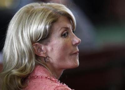 Democrat Texas State Sen. Wendy Davis listens as the state Senate meets to consider legislation to regulate abortion clinics in Austin, Texas, on July 12, 2013.