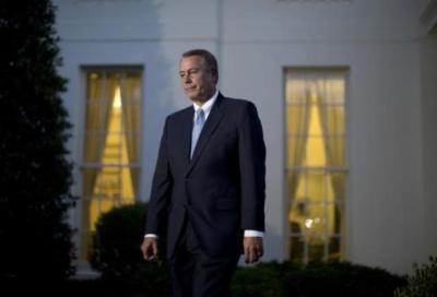 House Speaker John Boehner walks from a meeting with President Obama, House Minority Leader Nancy Pelosi, Senate Majority Leader Harry Reid and Senate Minority Leader Mitch McConnell outside the West Wing of the White House in Washington, D.C. Oct. 2, 2013.