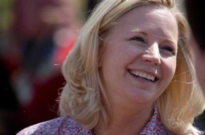 Senate candidate Liz Cheney speaks with voters during a Republican and Tea Party gathering in Emblem, Wyoming August 24, 2013.