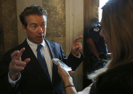 Senator Rand Paul (R-KY) speaks to the media before his party's working lunch on Capitol Hill in Washington October 8, 2013. U.S. Senate Democrats plan to introduce a bill this week to raise the government's borrowing authority by enough to last through 2014 in an effort to avoid a fiscal default that could have a disastrous economic impact.