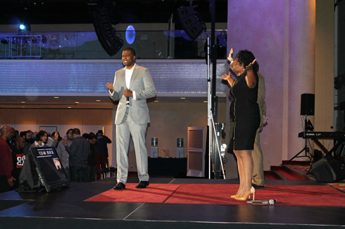 Dimas Salaberrios, president of Concerts of Prayer of Greater New York and pastor of Infinity Bible Church, leads Christian pastors, ministry leaders, and professionals in prayer at the Marriott Marquis Thursday, Oct. 10, 2013, in New York City for the fourth annual Movement Day.