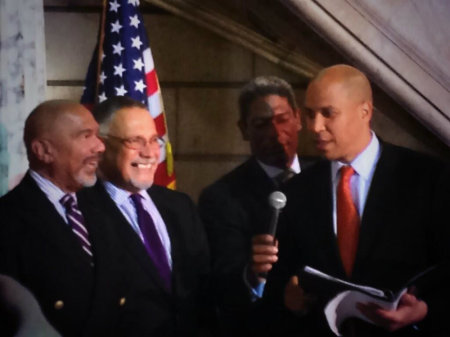 Newark, N.J., Mayor Cory Booker officiates a wedding ceremony at the local city hall on Monday, Oct. 21, 2013.