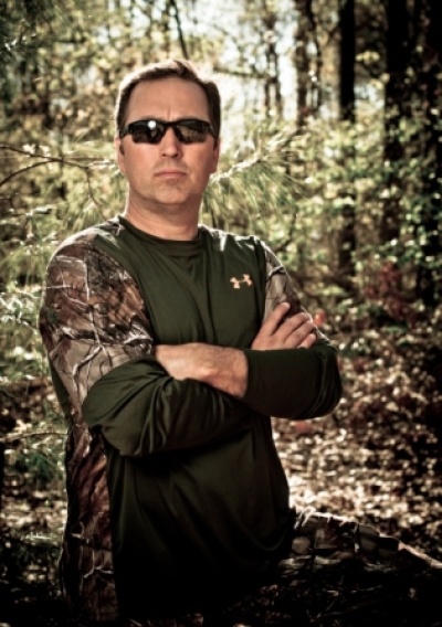 Alan Robertson, from A&E's most-watched reality TV show, 'Duck Dynasty,' poses in an Under Armour camouflage shirt.