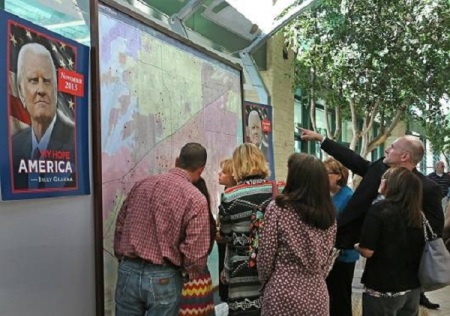 Organizers for the 'My Hope America with Billy Graham' project at Prestonwood Baptist Church posted giant maps of the surrounding area, using red dots to indicate a host home, [FILE]