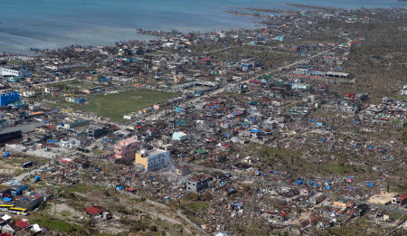 An aerial view of the devastation of super Typhoon Haiyan after it battered Samar province in central Philippines November 11, 2013. Dazed survivors of super Typhoon Haiyan that swept through the central Philippines killing an estimated 10,000 people begged for help and scavenged for food, water and medicine on Monday, threatening to overwhelm military and rescue resources.