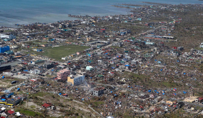 An aerial view of the devastation of super Typhoon Haiyan after it battered Samar province in central Philippines November 11, 2013. Dazed survivors of super Typhoon Haiyan that swept through the central Philippines killing an estimated 10,000 people begged for help and scavenged for food, water and medicine on Monday, threatening to overwhelm military and rescue resources.