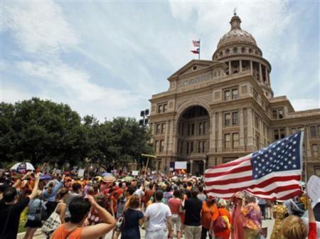 Protesters rally before the start of a special session of the Legislature in Austin, Texas, July 1, 2013.