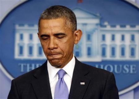 U.S. President Barack Obama pauses while he talks about the Affordable Care Act in the Brady Press Briefing Room at the White House in Washington, D.C., Nov. 14, 2013.