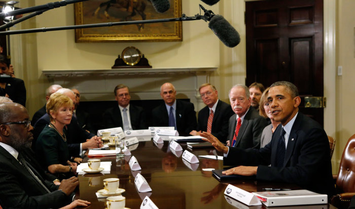 U.S. President Barack Obama meets with health insurance chief executives at the White House in Washington November 15, 2013. Obama said on Friday that he and his top advisors were 'brainstorming' with chief executives from top healthcare insurance companies about how to enroll Americans in health insurance before looming deadlines under his Obamacare healthcare law.