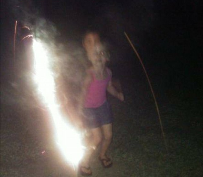 The McCabe family has claimed that their son, 9-year-old Nicolas, can be seen behind their niece, Madison, in this 4th of July photo. He was one of seven third graders who died at Plaza Towers Elementary School earlier this year in May when a hurricane hit Moore.