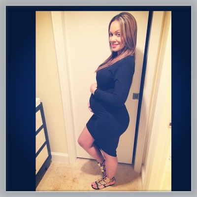 Evelyn Lozada cradles her baby bump