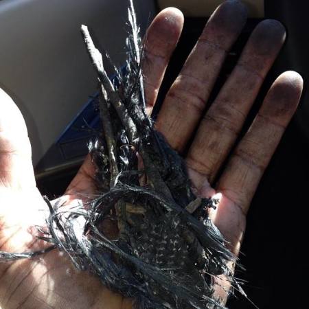 Tyrese Gibson holds bits of the wreckage from the crash site where his friend, Paul Walker died in Valencia, Calif., on Saturday.