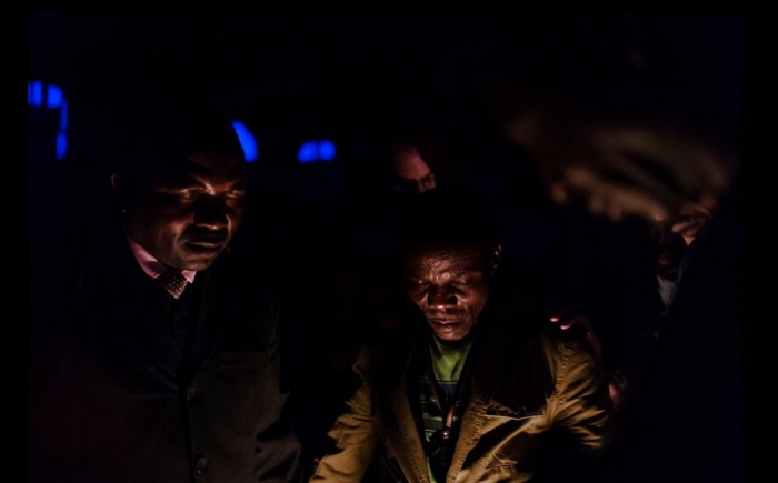 Congolese pastors gather together and pray as part of World Relief's Village Peace Committees.