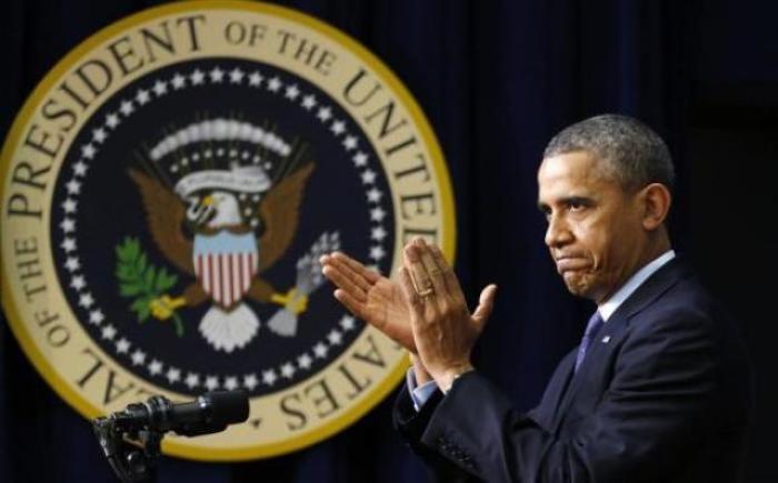 U.S. President Barack Obama applauds his audience during an event held in observance of World AIDS Day at the White House in Washington, D.C. Dec. 2, 2013.