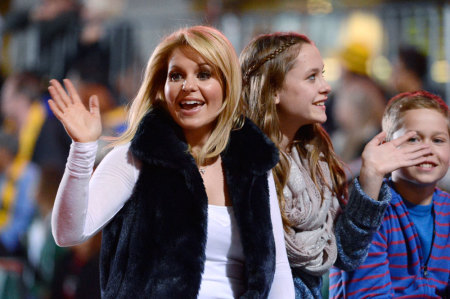 Actress Candace Cameron Bure (L) attends the 2012 Hollywood Christmas Parade in Los Angeles November 25, 2012.