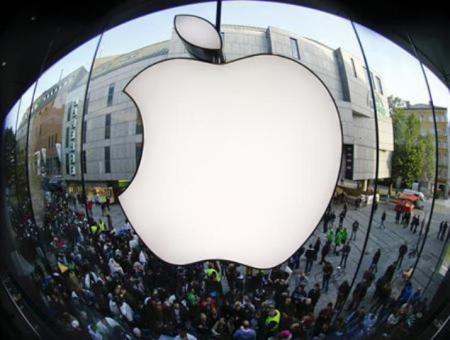 Customers gather outside an Apple store before the release of iPhone 5 in Munich, Germany, Sept. 21, 2012.