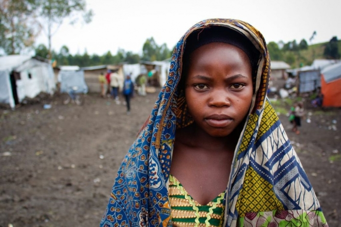 Muombi, 15, was separated from her mother when her family fled fighting in their village. She was then abandoned by her older brother, and now lives with family friends in the Mugunga 1 IDP camp in Goma, DRC. Every day Muombi goes into the forest in search of food, exposing herself to risks such as sexual violence and abuse in order to eat.