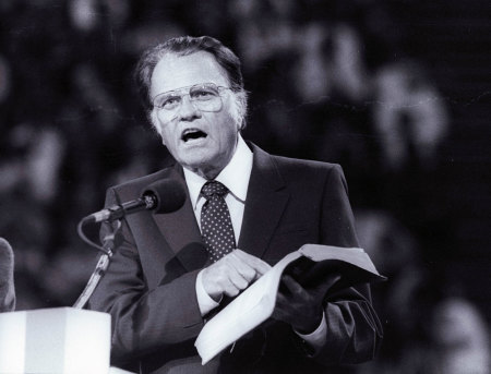 US evangelist Billy Graham preaches the Gospel to thousands of believers during tonight's meeting at Bercy's Stadium in Paris as part of a worldwide crusade, September 20, 1986.