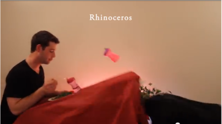 In 'How Animals Eat Their Food, Christian college students Ian Deibert and Nick Sjolinder act out animals in the act of consumption. Here, Sjolinder plays a rhinoceros and Deibert a confused bystander.