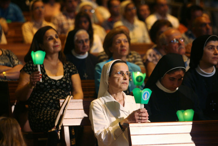 Lebanese and Syrian Christian Maronites pray for peace in Syria, in Harisa, Jounieh September 7, 2013.