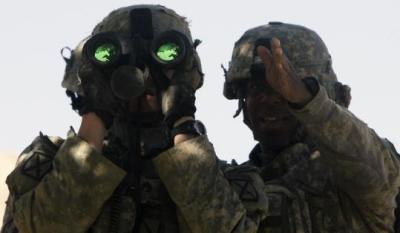 Lieutenant Gregory Avant [right] of the US Army’s Able Troop, Third Squadron, 71st Cavalry, 10th Mountain Division gave directions to his observer in Logar Province, Afghanistan.