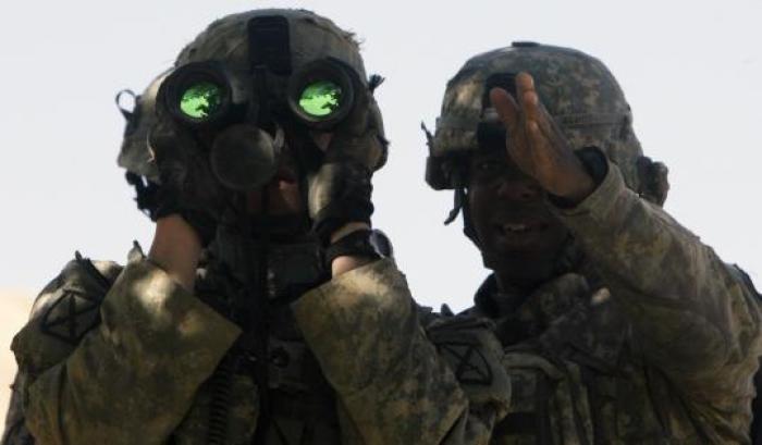 Lieutenant Gregory Avant [right] of the US Army's Able Troop, Third Squadron, 71st Cavalry, 10th Mountain Division gave directions to his observer in Logar Province, Afghanistan.