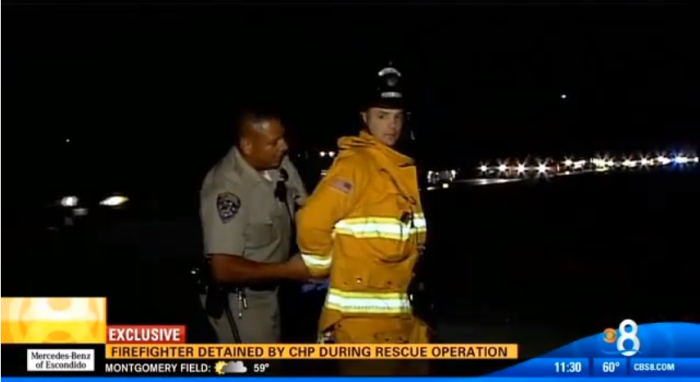 Chula Vista fire engineer, Jacob Gregoire, 36, (l) being arrested by an unidentified California Highway Patrol officer on Feb. 4, 2014.