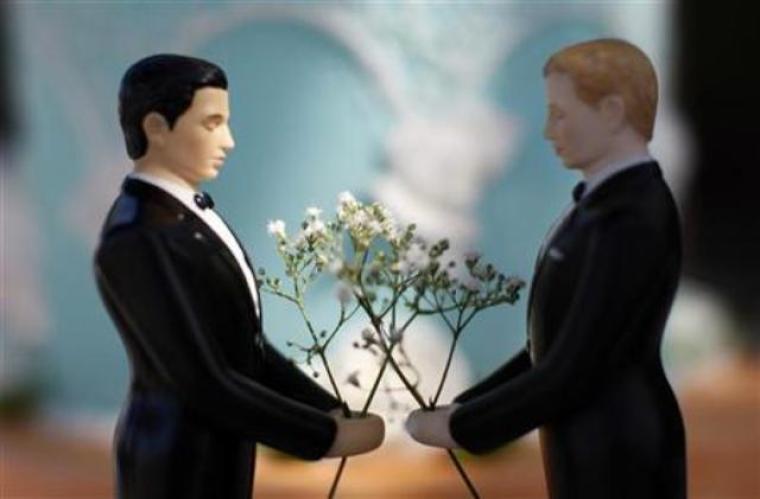 A same-sex wedding cake topper is seen outside the East Los Angeles County Recorder's Office on Valentine's Day during a news event for National Freedom to Marry Week in Los Angeles, Calif., Feb. 14, 2012.