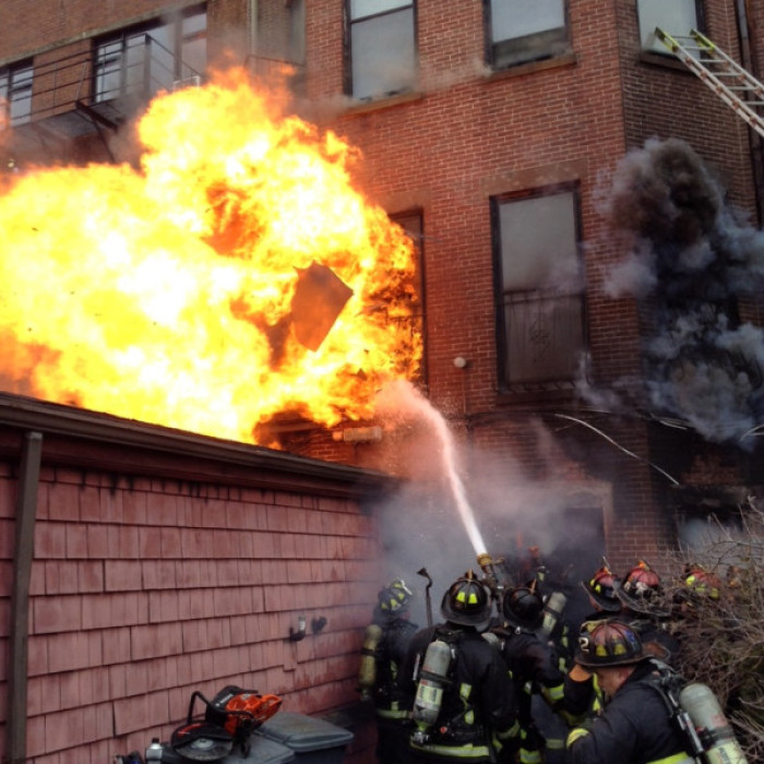 Boston firefighters fight a 9-alarm blaze in the city's Back Bay neighborhood Wednesday, March 26, 2014. Two fellow firefighters died in the blaze