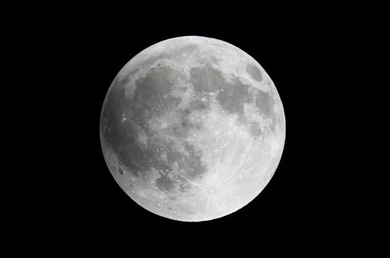 A shadow falls on the moon as it undergoes a total lunar eclipse as seen from Mexico City late April 14, 2014.