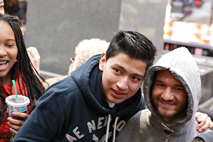 Christian evangelist Nick Vujicic gives out hugs Wednesday, April 16, 2014, in New York City's Times Square.