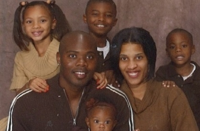 Cornealious Michael Anderson III poses for a photo with his family.