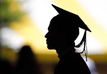 File photo of a young undergraduate waiting to receive his degree at his graduation ceremony.