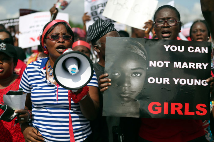 Woman holding signs take part in a protest demanding the release of abducted secondary school girls from the remote village of Chibok, in Lagos May 5, 2014. The Islamist militant group Boko Haram claimed responsibility on Monday for the abduction of more than 200 schoolgirls during a raid in the village of Chibok in northeast Nigeria last month, the French news agency AFP reported, citing a video it had obtained. Boko Haram on April 14 stormed an all-girl secondary school in Chibok, in Borno state, then packed the teenagers, who had been taking exams, onto trucks and disappeared into a remote area along the border with Cameroon.