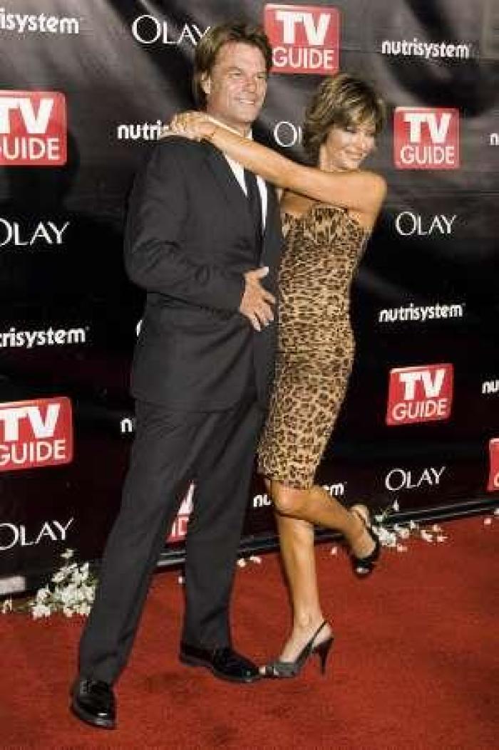 Harry Hamlin (L) and his wife Lisa Rinna arrive for the TV Guide Emmy Awards afterparty in Hollywood, California September 21, 2008.