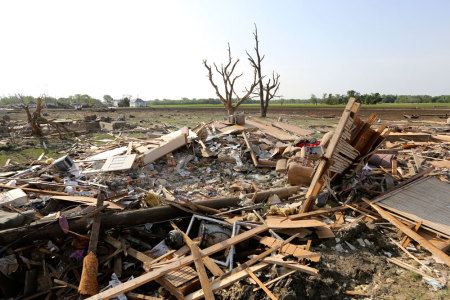 Debris is pictured in the town of Pilger, Nebraska June 17, 2014. Residents who were forced to leave a Nebraska village leveled by a tornado that killed a child and injured more than two dozen people began returning on Tuesday to salvage belongings from their battered homes, businesses, a church and school. The town of Pilger took a direct hit Monday afternoon as tornadoes swept across a farming area in northeast Nebraska, devastating up to 75 percent of its buildings, officials said.